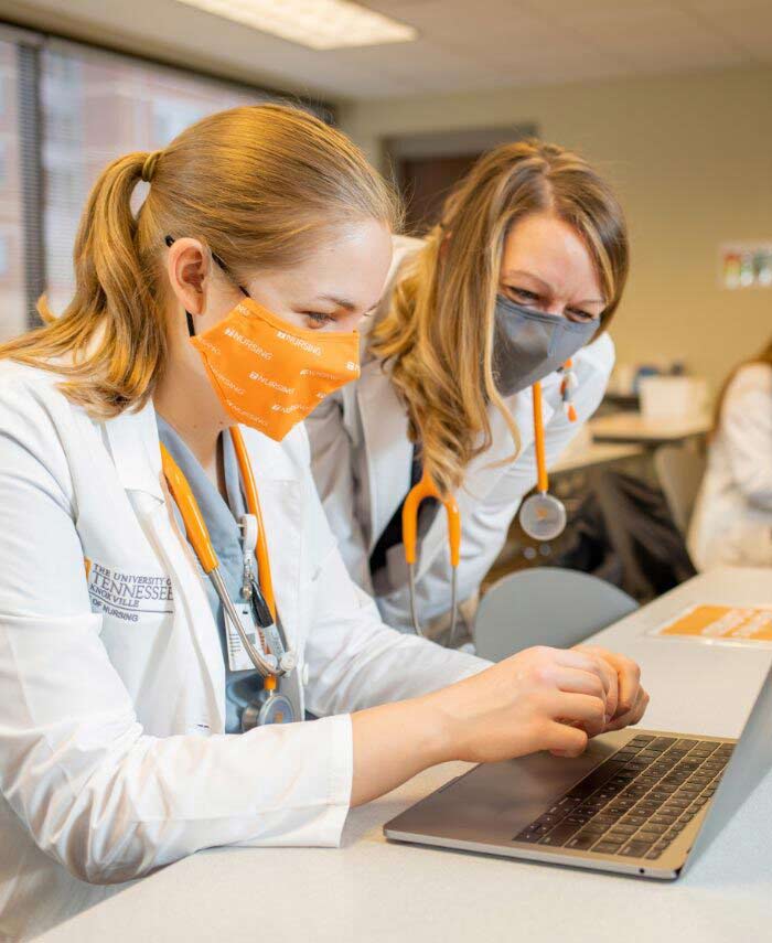 Nursing students using a virtual patient care app.